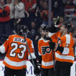 
              Philadelphia Flyers' Kevin Hayes, right, celebrates with Tanner Laczynski, and Lukas Sedlak after scoring a goal during the third period of an NHL hockey game against the New York Islanders, Tuesday, Nov. 29, 2022, in Philadelphia. (AP Photo/Matt Slocum)
            