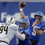 
              Memphis quarterback Seth Henigan (5) passes as he is pressured by Central Florida defensive tackle Anthony Montalvo (94) in the second half of an NCAA college football game Saturday, Nov. 5, 2022, in Memphis, Tenn. (AP Photo/Mark Humphrey)
            