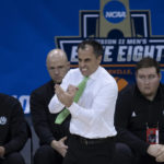 
              FILE - Northwest Missouri State coach Ben McCollum reacts during the team's semifinal against Black Hills State in the NCAA Division II men's college basketball tournament, Thursday, March 24, 2022, in Evansville, Ind. Ben McCollum was not a popular pick when Northwest Missouri State hired him to lead its men’s basketball program 14 years ago. He was 27 and had never been a head coach. Now, his Bearcats are coming off a third straight Division II national championship and their fourth in the last five NCAA Tournaments. (Denny Simmons/Evansville Courier & Press via AP, File)
            