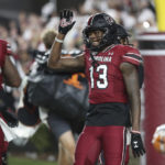 
              South Carolina wide receiver Jalen Brooks (13) waves goodbye to the Tennessee sideline after scoring a touchdown during the second half of an NCAA college football game Saturday, Nov. 19, 2022, in Columbia, S.C. (AP Photo/Artie Walker Jr.)
            