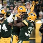 
              Green Bay Packers quarterback Aaron Rodgers, center left, and Aaron Jones (33), celebrate after Jones scored a touchdown during the first half of an NFL football game against the Dallas Cowboys Sunday, Nov. 13, 2022, in Green Bay, Wis. (AP Photo/Morry Gash)
            