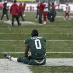 
              Michigan State wide receiver Keon Coleman sits in the end zone as Indiana celebrates the win after the second overtime of an NCAA college football game, Saturday, Nov. 19, 2022, in East Lansing, Mich. (AP Photo/Carlos Osorio)
            