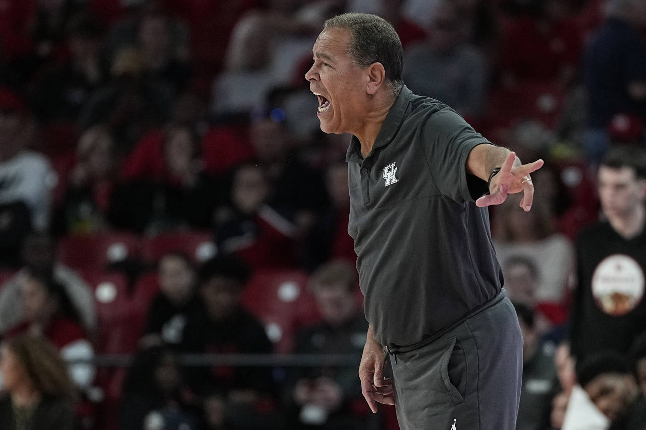 Houston head coach Kelvin Sampson reacts during the first half of an NCAA college basketball game a...