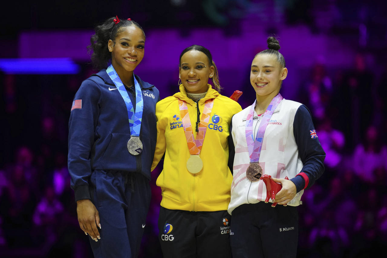 Gold medalist Rebeca Andrade of Brazil, centre, Silver medalist Shilese Jones of the U.S., left, an...