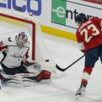 
              Florida Panthers center Carter Verhaeghe (23) makes a shot on goal as Washington Capitals goaltender Darcy Kuemper (35) defends during the second period of an NHL hockey game, Tuesday, Nov. 15, 2022, in Sunrise, Fla. (AP Photo/Marta Lavandier)
            