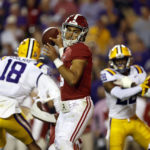 
              Alabama quarterback Bryce Young, center, looks to throw the ball during the first half of an NCAA college football game against LSU in Baton Rouge, La., Saturday, Nov. 5, 2022. (AP Photo/Tyler Kaufman)
            