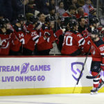 
              New Jersey Devils left wing Tomas Tatar (90) celebrates with teammates after scoring a goal against the Edmonton Oilers during the third period of an NHL hockey game Monday, Nov. 21, 2022, in Newark, N.J. (AP Photo/Adam Hunger)
            