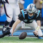 
              Carolina Panthers quarterback Sam Darnold recovers a fumble for a touchdown during the second half of an NFL football game between the Carolina Panthers and the Denver Broncos on Sunday, Nov. 27, 2022, in Charlotte, N.C. (AP Photo/Rusty Jones)
            