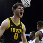 
              Iowa forward Filip Rebraca (0) reacts after making a basket against Seton Hall during the first half of an NCAA college basketball game Wednesday, Nov. 16, 2022, in Newark, N.J. (AP Photo/Adam Hunger)
            