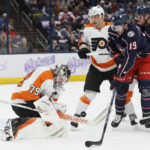 
              Philadelphia Flyers' Carter Hart, left, makes a save against Columbus Blue Jackets' Liam Foudy during the second period of an NHL hockey game Tuesday, Nov. 15, 2022, in Columbus, Ohio. (AP Photo/Jay LaPrete)
            
