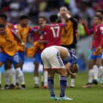
              Japan's Takuma Asano, foreground, reacts at the end of the World Cup, group E soccer match between Japan and Costa Rica, at the Ahmad Bin Ali Stadium in Al Rayyan , Qatar, Sunday, Nov. 27, 2022. Costa Rica won 1-0. (AP Photo/Ariel Schalit)
            