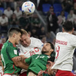 
              Poland's Kamil Glik and Mexico's Cesar Montes go for a header during a World Cup group C soccer match at the Stadium 974 in Doha, Qatar, Tuesday, Nov. 22, 2022. (AP Photo/Martin Meissner)
            