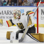 
              Vegas Golden Knights goaltender Logan Thompson makes a glove save during the first period of the team's NHL hockey game against the Buffalo Sabres, Thursday, Nov. 10, 2022, in Buffalo, N.Y. (AP Photo/Jeffrey T. Barnes)
            