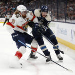 
              Columbus Blue Jackets forward Eric Robinson, right, chases the puck in front of Florida Panthers defenseman Marc Staal during the second period an NHL hockey game in Columbus, Ohio, Sunday, Nov. 20, 2022. (AP Photo/Paul Vernon)
            