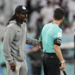 
              Senegal's head coach Aliou Cisse talks with an assistant referee during the World Cup group A soccer match between Qatar and Senegal, at the Al Thumama Stadium in Doha, Qatar, Friday, Nov. 25, 2022. (AP Photo/Thanassis Stavrakis)
            
