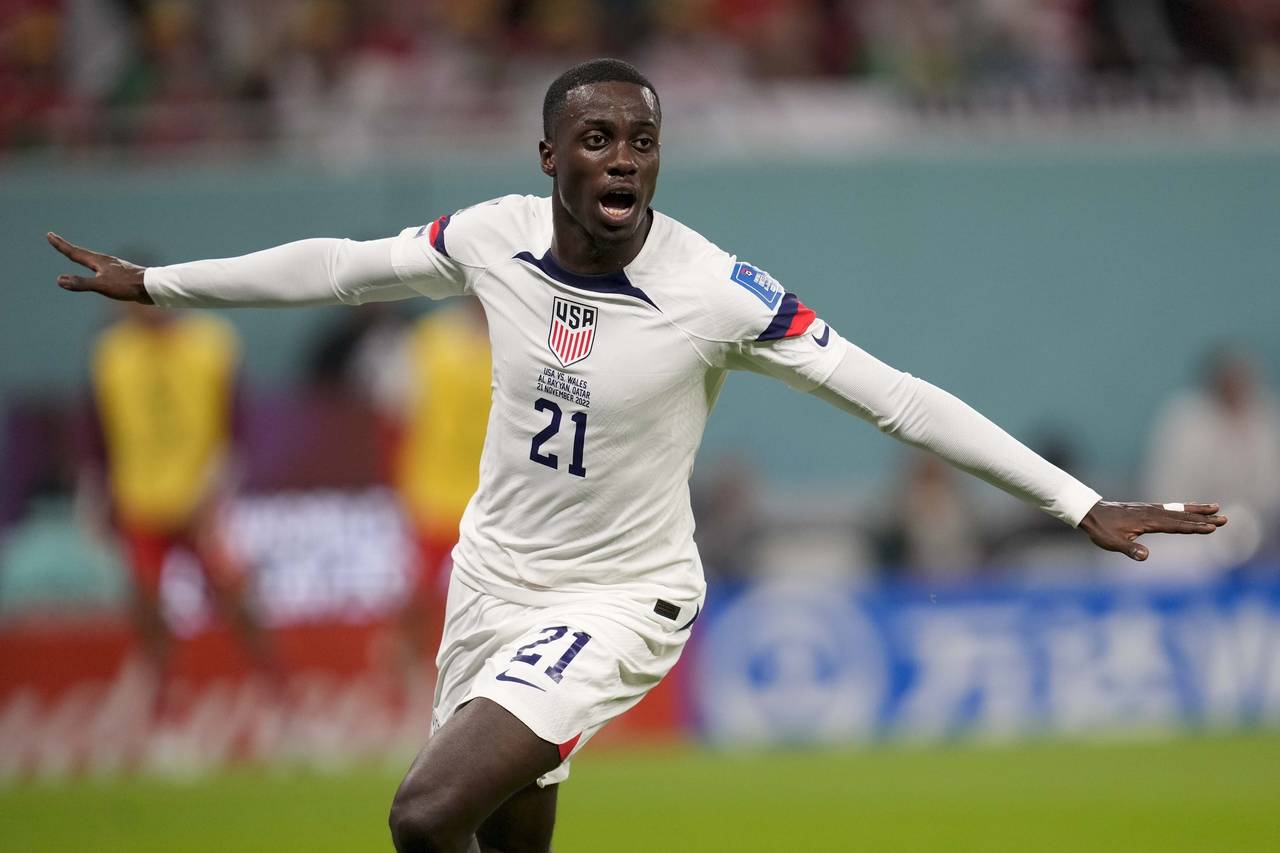 Tim Weah of the United States, celebrates after scoring during the World Cup, group B soccer match ...