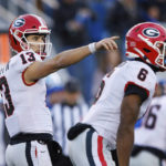 
              Georgia quarterback Stetson Bennett (13) points at a defender during the first half of an NCAA college football game against Kentucky in Lexington, Ky., Saturday, Nov. 19, 2022. (AP Photo/Michael Clubb)
            
