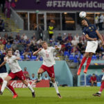 
              France's Raphael Varane, second right, goes for a header during the World Cup group D soccer match between France and Denmark, at the Stadium 974 in Doha, Qatar, Saturday, Nov. 26, 2022. (AP Photo/Frank Augstein)
            