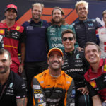 
              Aston Martin driver Sebastian Vettel, of Germany, top row center, poses for a picture with other drivers ahead of the Emirates Formula One Grand Prix, at the Yas Marina racetrack, in Abu Dhabi, United Arab Emirates, in Abu Dhabi, United Arab Emirates Sunday, Nov. 20, 2022. (AP Photo/Hussein Malla)
            