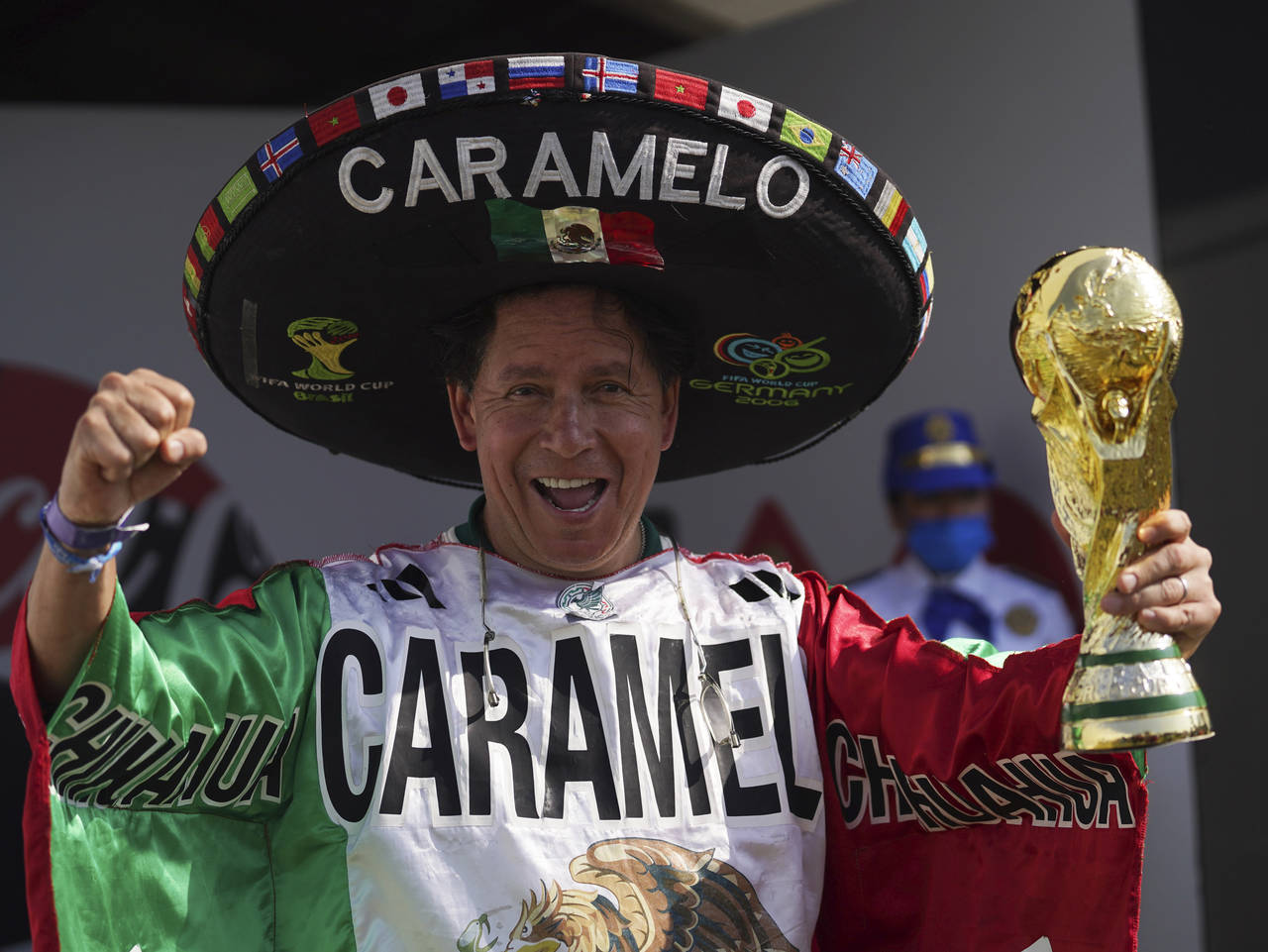 FILE - Mexico national soccer team fan Hector Chavez, also known as Caramelo, poses with a replica ...