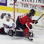 
              Canada's Marie-Philip Poulin (29) scores on a penalty shot goal on U.S. goaltender Maddie Rooney (35) during the second period of a Rivalry Series hockey game Thursday, Nov. 17, 2022, in Kamloops, British Columbia. (Jesse Johnston/The Canadian Press via AP)
            