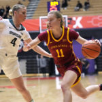 
              Iowa State guard Emily Ryan (11) drives as Michigan State guard Theryn Hallock (4) defends during the first half of an NCAA college basketball game in the Phil Knight Invitational tournament Thursday, Nov. 24, 2022, in Portland, Ore. (AP Photo/Rick Bowmer)
            