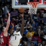 
              New Orleans Pelicans forward Zion Williamson (1) goes to the basket against Portland Trail Blazers forward Drew Eubanks (24) in the second half of an NBA basketball game in New Orleans, Thursday, Nov. 10, 2022. The Trail Blazers won 106-95. (AP Photo/Gerald Herbert)
            