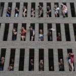 
              Fans cheer from a parking deck during a victory parade for the Houston Astros' World Series baseball champions Monday, Nov. 7, 2022, in Houston. (AP Photo/David J. Phillip)
            