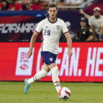 
              FILE - United States defender Joe Scally (29) plays during the second half of a friendly soccer match against Morocco, Wednesday, June 1, 2022, in Cincinnati. Tim Ream, Haji Wright, Joe Scally and Sean Johnson made the United States’ World Cup roster.  (AP Photo/Jeff Dean, File)
            