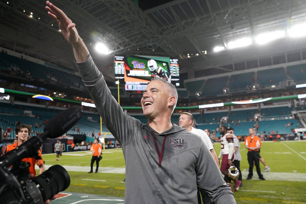 Florida State head coach Mike Norvell waves to fans after an NCAA college football game against Mia...