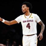 
              Arizona State's Desmond Cambridge Jr. (4) gestures to a teammate during the second half of an NCAA college basketball game against Michigan in the championship round of the Legends Classic Thursday, Nov. 17, 2022, in New York. Arizona State won 87-62. (AP Photo/Frank Franklin II)
            