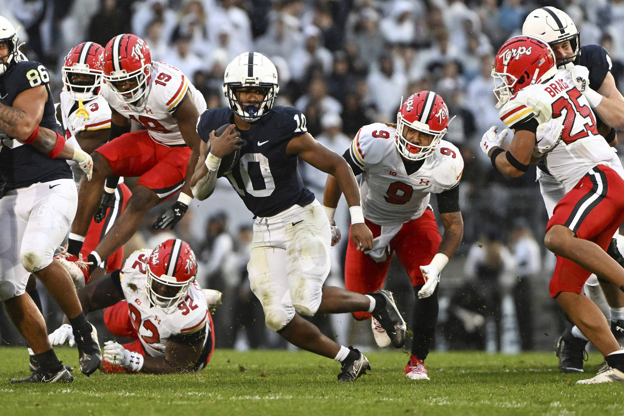 Penn State running back Nicholas Singleton scores a touchdown against Maryland during the first hal...