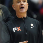 
              Oregon State head coach Scott Rueck shouts to his team during the first half of an NCAA college basketball game against Iowa in the Phil Knight Legacy tournament Friday, Nov. 25, 2022, in Portland, Ore. (AP Photo/Rick Bowmer)
            