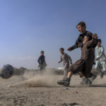 
              Afghan children play soccer on the outskirts of Kabul, Afghanistan, Friday, Nov. 11, 2022. (AP Photo/Ebrahim Noroozi)
            