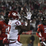 
              Oklahoma wide receiver Marvin Mims Jr. (17) catches a touchdown pass against Texas Tech during the first half of an NCAA college football game Saturday, Nov. 26, 2022, in Lubbock, Texas. (AP Photo/Justin Rex)
            