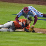 
              Philadelphia Phillies first baseman Rhys Hoskins tags Houston Astros' Yuli Gurriel in a run down during the seventh inning in Game 5 of baseball's World Series between the Houston Astros and the Philadelphia Phillies on Thursday, Nov. 3, 2022, in Philadelphia. (AP Photo/Matt Rourke)
            