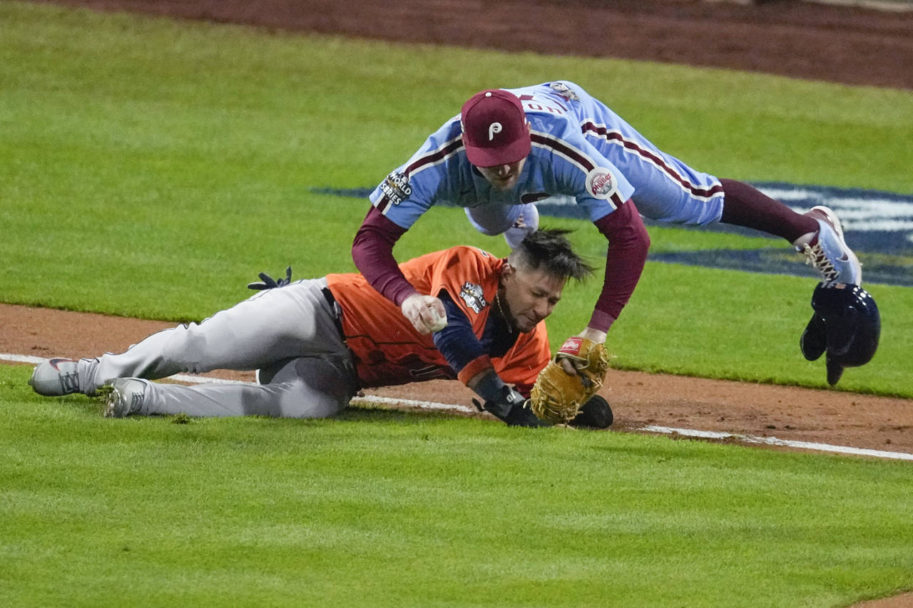 Philadelphia Phillies first baseman Rhys Hoskins tags Houston Astros' Yuli Gurriel in a run down du...