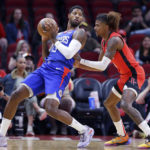 
              Los Angeles Clippers guard Paul George (13) leans back into Houston Rockets guard Jalen Green during the first half of an NBA basketball game Wednesday, Nov. 2, 2022, in Houston. (AP Photo/Michael Wyke)
            