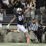 
              Penn State tight end Theo Johnson (84) scores a touchdown during the first half of an NCAA college football game against Michigan State, Saturday, Nov. 26, 2022, in State College, Pa. (AP Photo/Barry Reeger)
            