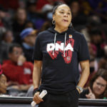 
              FILE - South Carolina head coach Dawn Staley watches her team during the second half of an NCAA college basketball exhibition game against Benedict in Columbia, S.C., Monday, Oct. 31, 2022. The Atlantic Coast and Southeastern conferences have led the way among the power conferences in hiring coaches of color to lead women’s basketball programs. “There is an influx of Black women getting opportunities,” South Carolina coach Dawn Staley said.(AP Photo/Nell Redmond, File)
            