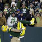 
              Green Bay Packers wide receiver Christian Watson (9) does a backflip after catching a long pass for a touchdown during the first half of an NFL football game against the Dallas Cowboys Sunday, Nov. 13, 2022, in Green Bay, Wis. (AP Photo/Mike Roemer)
            