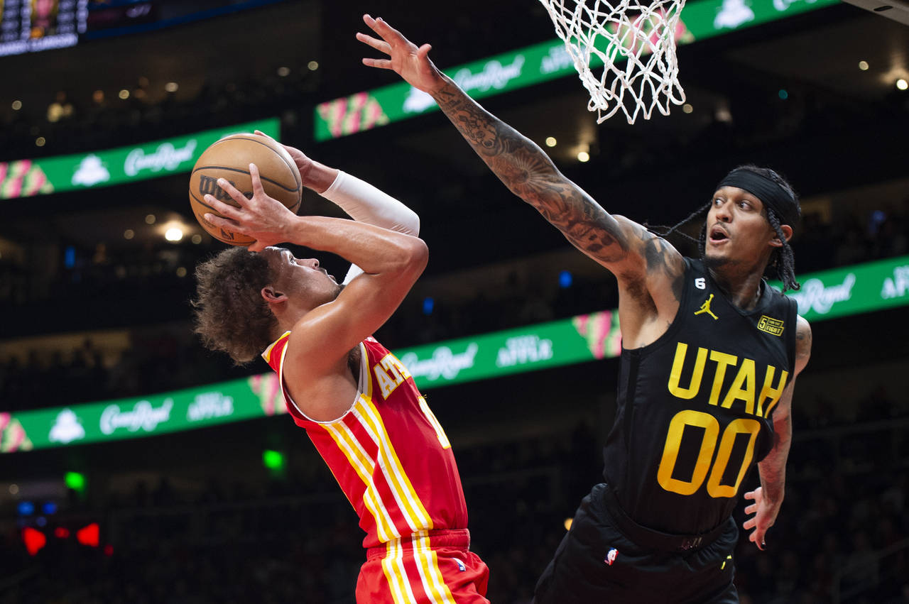 Atlanta Hawks' Trae Young shoots over Utah Jazz's Jordan Clarkson during the second half of an NBA ...