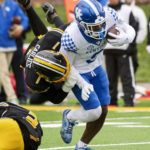 
              Kentucky wide receiver Tayvion Robinson, right, is tackled by Missouri defensive back Jaylon Carlies, left, during the third quarter of an NCAA college football game Saturday, Nov. 5, 2022, in Columbia, Mo. (AP Photo/L.G. Patterson)
            