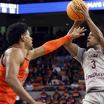 
              Texas Southern guard PJ Henry (3) shoots over Auburn center Dylan Cardwell (44) during the first half of an NCAA college basketball game Friday, Nov. 18, 2022, in Auburn, Ala. (AP Photo/Butch Dill)
            