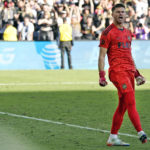 
              Los Angeles FC goalkeeper John McCarthy (77) celebrates after making a stop during a penalty kick shootout against the against the Philadelphia Union in the MLS Cup soccer match, Saturday, Nov. 5, 2022, in Los Angeles. (AP Photo/Marcio Jose Sanchez)
            