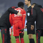 
              Bayern's Alphonso Davies holds his upper leg while he leaves the pitch during the German Bundesliga soccer match between Hertha BSC Berlin and FC Bayern Munich in Berlin, Germany, Saturday, Nov. 5, 2022. (AP Photo/Michael Sohn)
            