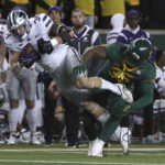 
              Kansas State tight end Ben Sinnott catches a pass over Baylor linebacker Jackie Marshall in the first half of an NCAA college football game, Saturday, Nov. 12, 2022, in Waco, Texas. (AP Photo/Jerry Larson)
            