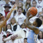 
              North Carolina's Caleb Love (2) shoots over Indiana's Trayce Jackson-Davis (23) during the second half of an NCAA college basketball game, Wednesday, Nov. 30, 2022, in Bloomington, Ind. (AP Photo/Darron Cummings)
            