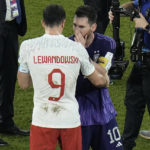
              Poland's Robert Lewandowski, left, interacts with Argentina's Lionel Messi at the end of the World Cup group C soccer match between Poland and Argentina at the Stadium 974 in Doha, Qatar, Wednesday, Nov. 30, 2022. (AP Photo/Hassan Ammar)
            