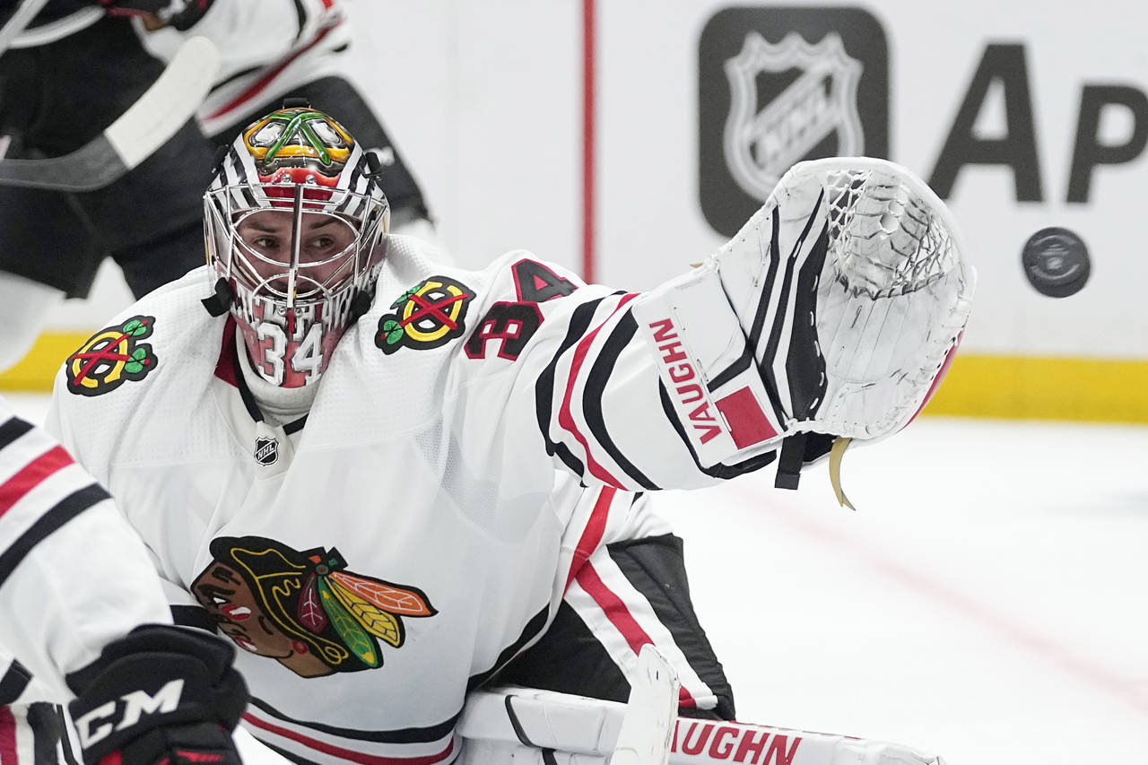 The puck gets by Chicago Blackhawks goaltender Petr Mrazek before hitting the post and bouncing off...